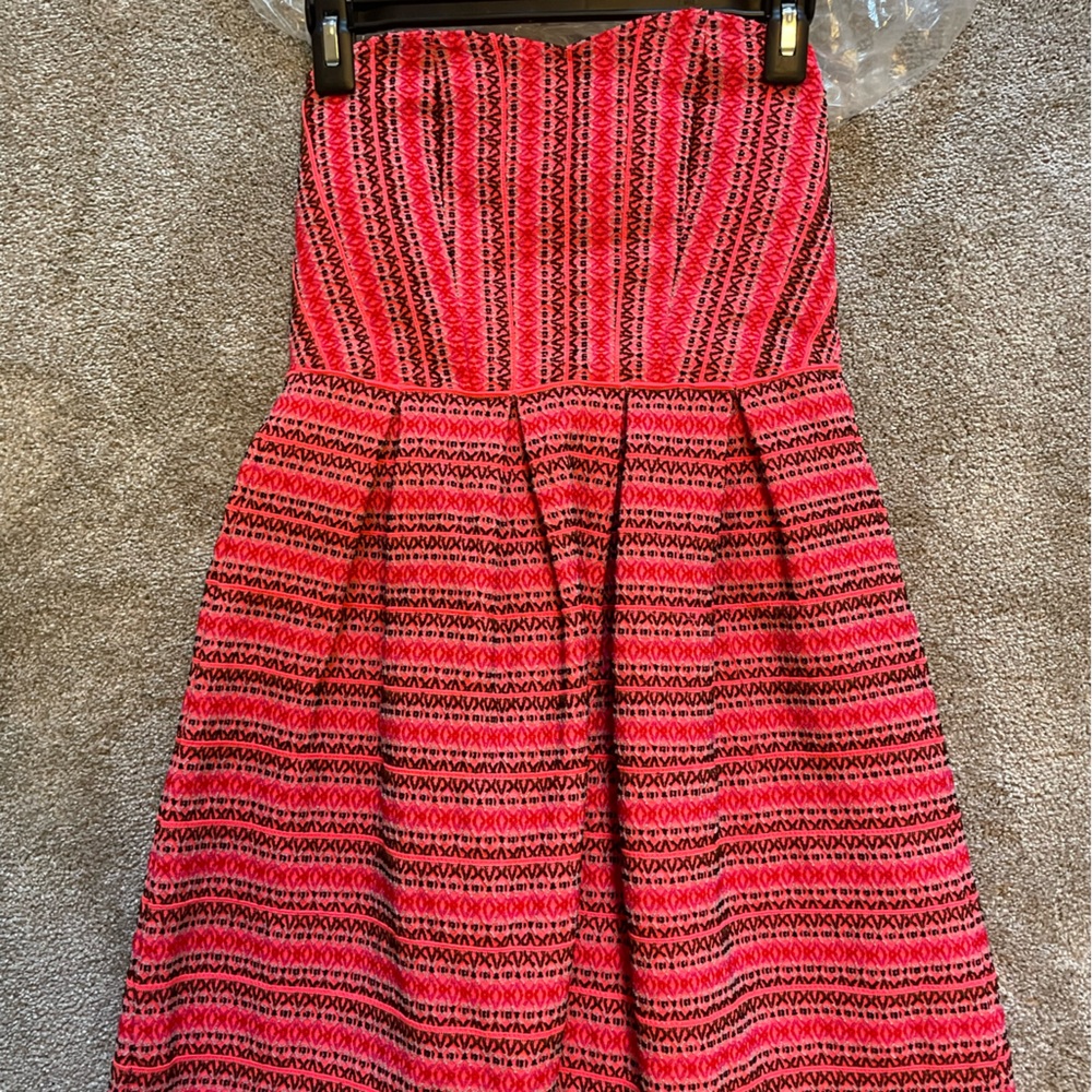 Neon pink cocktail dress, strapless. Worn a few times. Just dried cleaned.